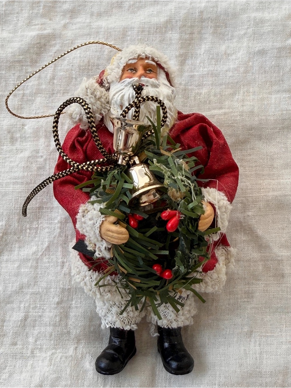 Festive Red Santa Figurine Ornament with Wreath and Bell
